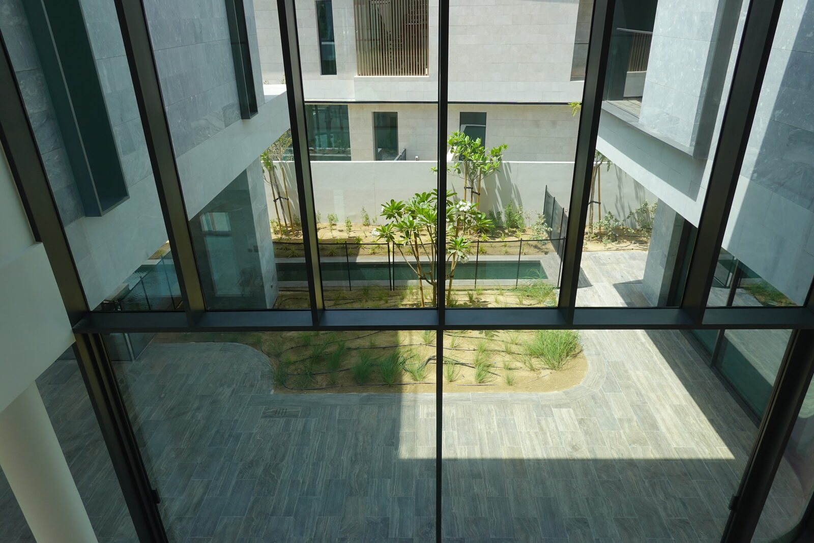 Double-height glass courtyard